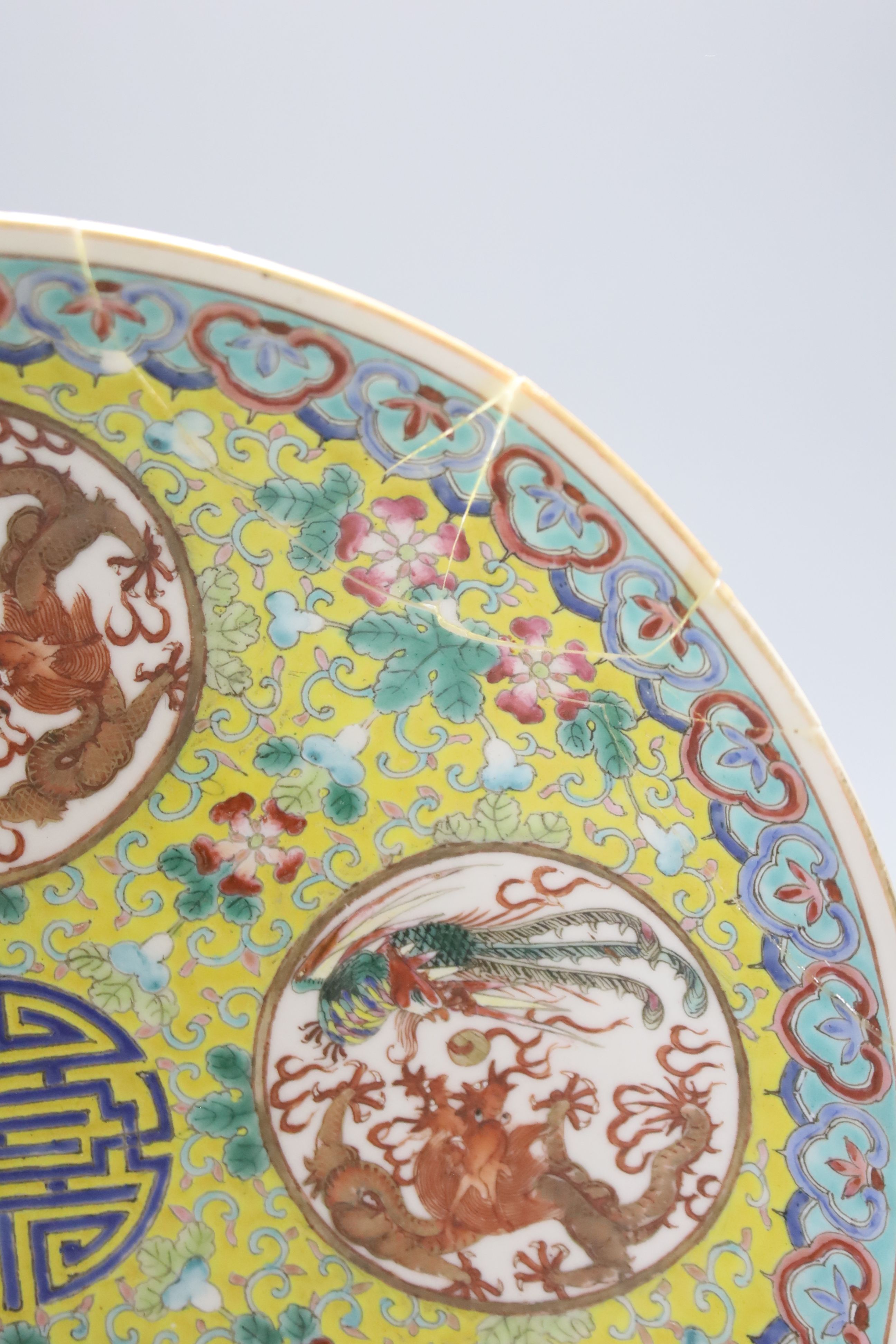 Two Chinese blue and white vases and a dish, together with a famille rose dish, tallest 28cm